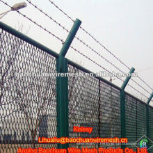 Green powder coated welded fence with barbed wire